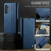 A dark background with a blue leather phone case displayed. Produktbild-Vorschau