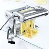 A chrome pasta maker with fresh pasta coming out of it, set against a white background. Náhľad obrázku produktu