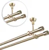 A double curtain rod with antique gold finish, mounted to the ceiling. Anteprima dell’immagine prodotto