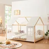 A child's bed designed like a house, set up in a room with bedding and stuffed animals. Anteprima dell’immagine prodotto