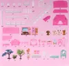 A flat lay of a dollhouse and its accessories, laid out on a pink background. Voir les images du produit