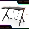 A black gaming desk with orange accents is shown with dimensions indicated by text and lines. Produktbild-Vorschau