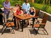 People enjoying a meal outdoors at a patio table. Anteprima dell’immagine prodotto
