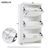 A white shoe cabinet with three flip-down doors, shown with dimensions indicated by measurement lines and numbers. Anteprima dell’immagine prodotto