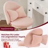 A pink fluffy chair with decorative pillows, placed near a white dresser. The image is split into two sections, with the top showing the chair and the bottom showing a close-up of the chair's texture and a gift box. Produktbild-Vorschau