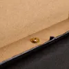 A close-up view of the edge of a bed frame, showing a metal fastener and the wooden particle board construction. Voir les images du produit