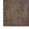 A close-up view of a textured rug with a curved pattern. Podgląd zdjęcia produktu