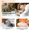 Collage of images showing cats interacting with cat treats and ingredients for cat food. Produktbild-Vorschau