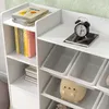 A white children's storage unit with books and toys. Náhled obrázku produktu