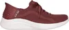 A side view of a red Skechers slip-on sneaker with a white sole. Voir les images du produit