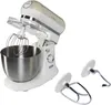 A white and cream colored stand mixer with a silver bowl and attachments. Náhled obrázku produktu