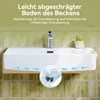 A white ceramic sink mounted on a wall with green tiled backsplash. Text overlays describe a feature of the sink. Produktbild-Vorschau