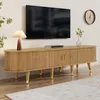 A modern living room scene featuring a TV stand with a TV mounted above it, a lamp, and decorative items. Produktbild-Vorschau
