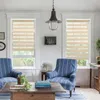 A living room scene with two chairs, a coffee table, and windows with blinds. Voir les images du produit