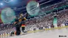 A hockey player celebrating on the ice in a stadium. Produktbild-Vorschau