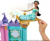 A doll is shown riding a magic carpet that is part of a playset. Podgląd zdjęcia produktu