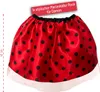 A red and black polka dot skirt with a white trim, displayed against a white background. Produktbild-Vorschau