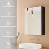 A bathroom scene with a medicine cabinet, sink, and faucet. Podgląd zdjęcia produktu