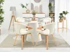 A dining room setting with a round table and chairs. Produktbild-Vorschau