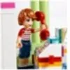A Lego Friends character is playing with a toy ice cream stand. Náhled obrázku produktu