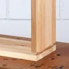 A close-up view of a wooden joint being assembled on a workbench. Anteprima dell’immagine prodotto