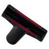 A close-up shot of a black vacuum cleaner attachment with red trim against a white background. Produktbild-Vorschau