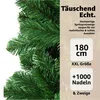 A close-up of a green artificial Christmas tree with marketing text and product specifications. Produktbild-Vorschau