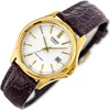 A close-up shot of a gold-colored Casio watch with a white face and a brown leather strap, set against a white background. Anteprima dell’immagine prodotto