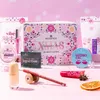 A collection of essence beauty products arranged on a pink, snowy surface, with a festive Christmas theme. Náhled obrázku produktu