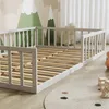 A child's bed frame with safety rails, set up in a room with mountain-themed wallpaper and a circular rug. Anteprima dell’immagine prodotto