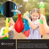 Children playing with water guns and a water balloon filled from a tap, suggesting outdoor fun. Produktbild-Vorschau