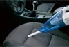 A handheld vacuum cleaner is being used to clean a car seat. Podgląd zdjęcia produktu