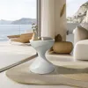 A modern living room with a view of the ocean, featuring a stylish side table. Anteprima dell’immagine prodotto