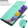 A teal flip phone case with a floral design is shown open, revealing a smartphone screen. Náhled obrázku produktu