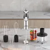 An immersion blender set with various attachments is displayed on a kitchen counter. Anteprima dell’immagine prodotto