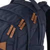 A close-up view of a navy blue backpack with brown leather zipper pulls. Podgląd zdjęcia produktu