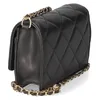 A black quilted handbag with a gold chain strap is shown against a white background. Produktbild-Vorschau
