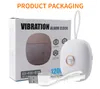 A product shot showing the packaging and the product itself, a white vibration alarm clock. Podgląd zdjęcia produktu