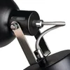 Close-up view of the adjustable joint and flexible conduit of a black lamp. Podgląd zdjęcia produktu