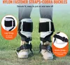 A person wearing climbing spikes on their boots, standing on grass. Anteprima dell’immagine prodotto