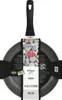 A frying pan with its packaging and informational tags. Produktbild-Vorschau