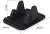 A black silicone phone stand with dimensions indicated. Produktbild-Vorschau