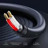 A close-up, cross-section view of a black audio cable, highlighting its internal components and materials. Podgląd zdjęcia produktu
