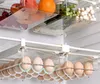 A close-up view of refrigerator drawers filled with food, including eggs, fruits, and vegetables. Náhled obrázku produktu
