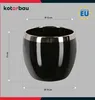 A black ceramic pot with a gold rim, shown with dimensions indicated. Náhľad obrázku produktu