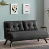 A dark gray sofa is placed in a room with light blue walls and wooden flooring. Náhled obrázku produktu