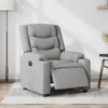 A light gray fabric recliner chair is shown in a room with a floor lamp and a small side table. Produktbild-Vorschau