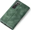 A green flip cover case for a smartphone is shown from a diagonal angle against a white background. Produktbild-Vorschau