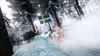 A rally car racing on a snowy track with trees and a Swedish flag. Produktbild-Vorschau