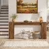 A console table with decorative items and baskets in a hallway with stairs and a rug. Náhľad obrázku produktu